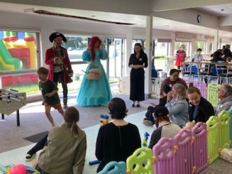 Costumed performers entertain children and families